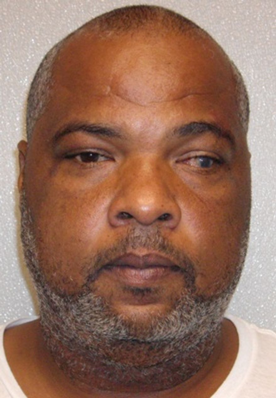 This undated booking photo released by the Prince George's County Police shows 43-year-old Darrell Lynn Bellard, of Dickinson, Texas. Bellard and 18-year-old Tkeisha Nicole Gilmer, of Texas City, Texas have each been charged with murder in the slayings of two women and two children found in a trash-filled apartment in the Washington area. (AP Photo/Prince George's County Police)