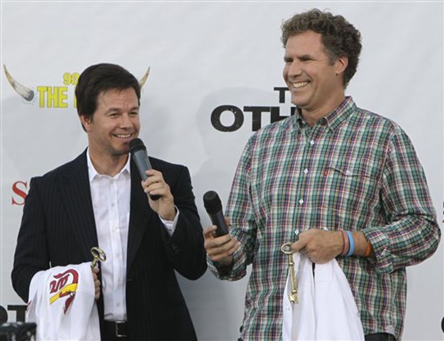 Actors Mark Wahlberg, left, and Will Ferrell laugh as they speak to a large crowd gathered for a premiere of their new movie "The Other Guys" at Wehrenberg Chesterfield Galaxy theater Thursday, Aug. 5, 2010, in Chesterfield, Mo. The St. Louis area was picked to host the event as a result of fan voting on Facebook. (AP Photo/Jeff Roberson)