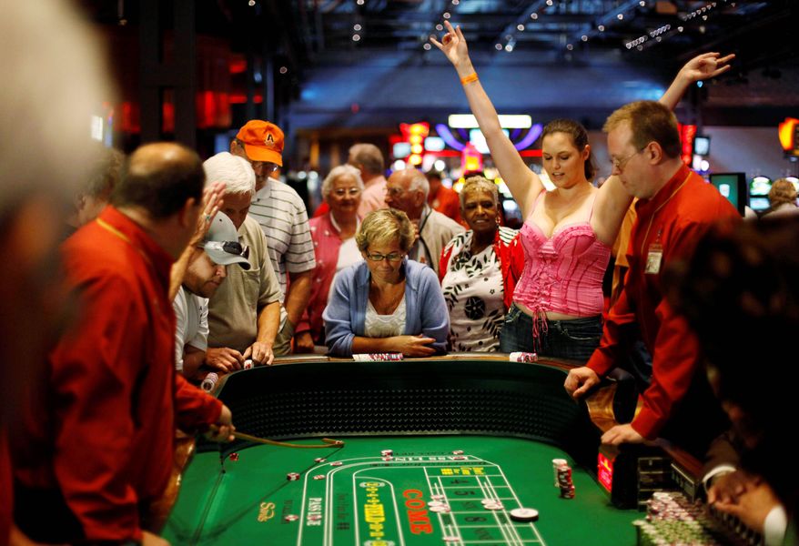 Recently legalized table games attract a crowd at the Sands Casino Resort Bethlehem in Pennsylvania on July 16. States increasingly are looking to more casinos with more game options as a way to meet their budgets without raising taxes, but that may mean they get smaller shares of the same pot. (Associated Press)