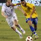 ** FILE ** Brazil midfielder Neymar (right) holds off U.S. defender Jonathan Spector as he dribbles the ball during the first half of an international soccer match Tuesday, Aug. 10, 2010, at New Meadowlands Stadium in East Rutherford, N.J. (AP Photo/Bill Kostroun, File)