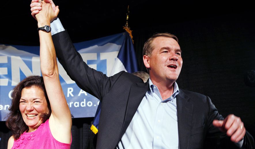 Sen. Michael Bennet, Colorado Democrat, celebrates with his wife, Susan Dagget, at an election party on Tuesday, Aug. 10, 2010, in Denver after winning the Democratic primary. (AP Photo)
