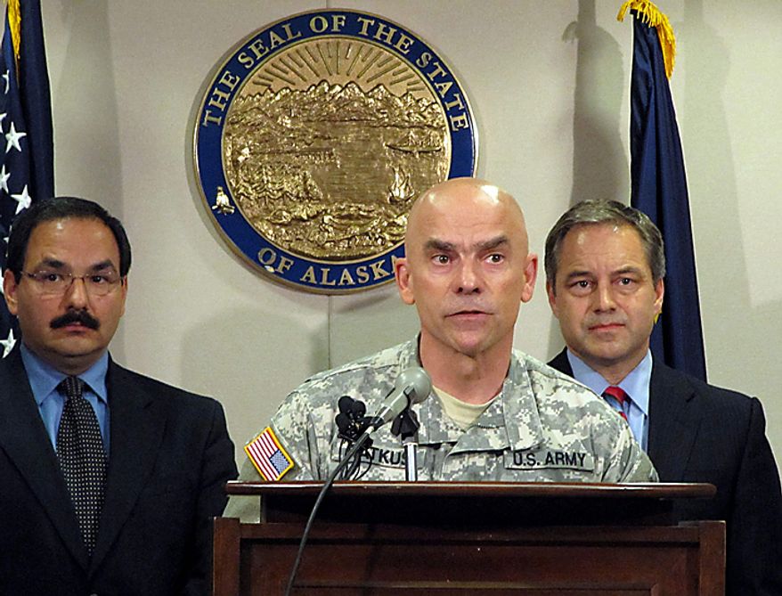 Maj. Gen. Thomas Katkus, center, adjutant general of the state Department of Military and Veterans Affairs, Alaska Gov. Sean Parnell , right, and Public Safety Commissioner Joe Masters, speak at a news conference about the plane crash that killed former Sen. Ted Stevens. The plane carrying Stevens and ex-NASA chief Sean O'Keefe crashed into a remote mountainside in Alaska, killing the longtime senator and a number of others, authorities said Tuesday. (AP Photo/Rachel D'oro)