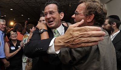Democratic gubernatorial candidate Dan Malloy celebrates with supporters after defeating businessman Ned Lamont in the Democratic primary for Connecticut governor, in Hartford, Conn., on Tuesday, Aug. 10, 2010. (AP Photo/Jessica Hill)