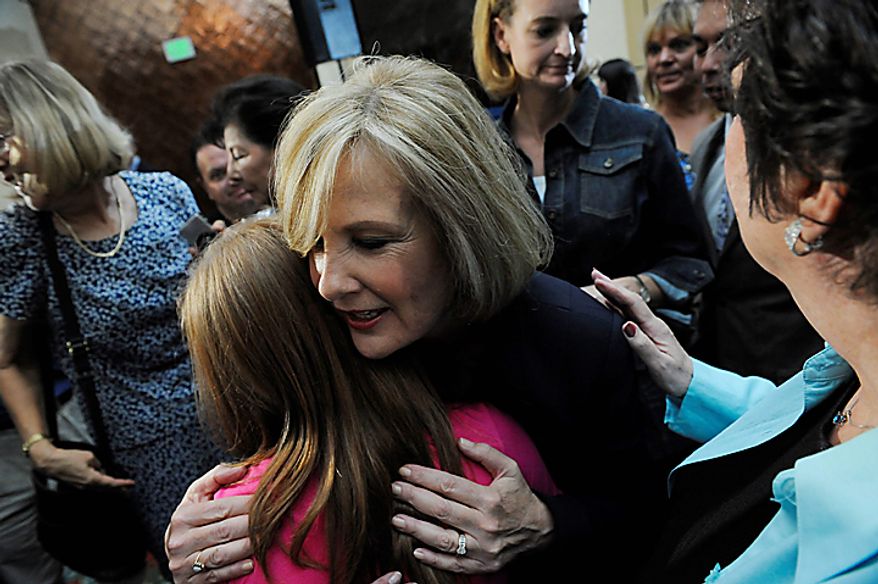 GOP Senatorial candidate, Jane Norton hugs supporters after giving her concession speech on Tuesday Aug. 10, 2010 at the Marriott in Highlands Ranch, Colo. Buck, the Weld District Attorney, defeated former Colorado Lieutenant Governor Jane Norton for the nomination. (AP Photo/MATT MCCLAIN, The Denver Post)