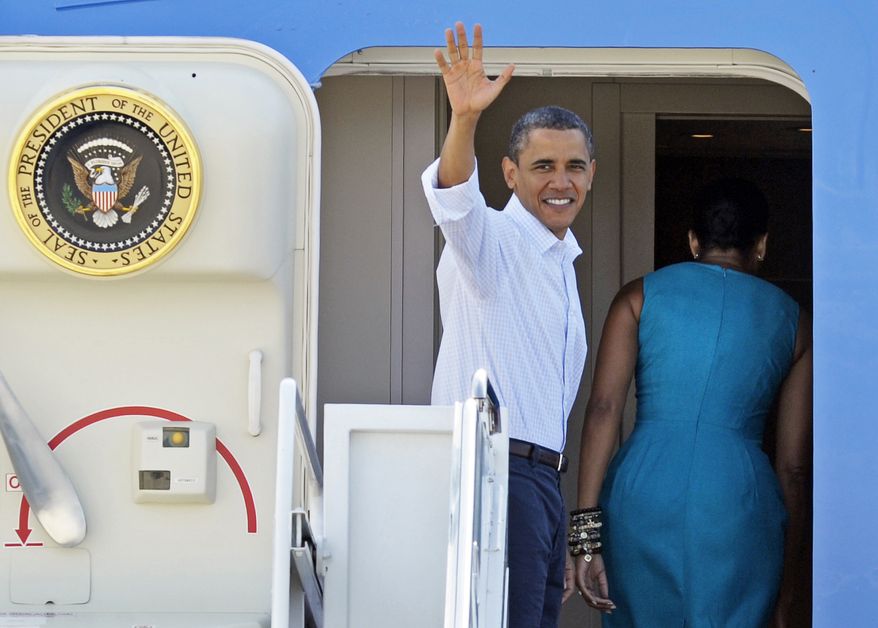 President Barack Obama waves as he and first lady MIchelle Obama board Air Force One at Andrews Air Force Base, Md., Saturday, Aug. 14, 2010, for a weekend in Panama City, Fla. The first family, absent Malia who is at summer camp, plans to spend time enjoying the area's recreational activities. But the president has also scheduled a meeting with small-business owners as the government's focus moves from plugging the oil leak to rebuilding the region's economy. (AP Photo/Cliff Owen)