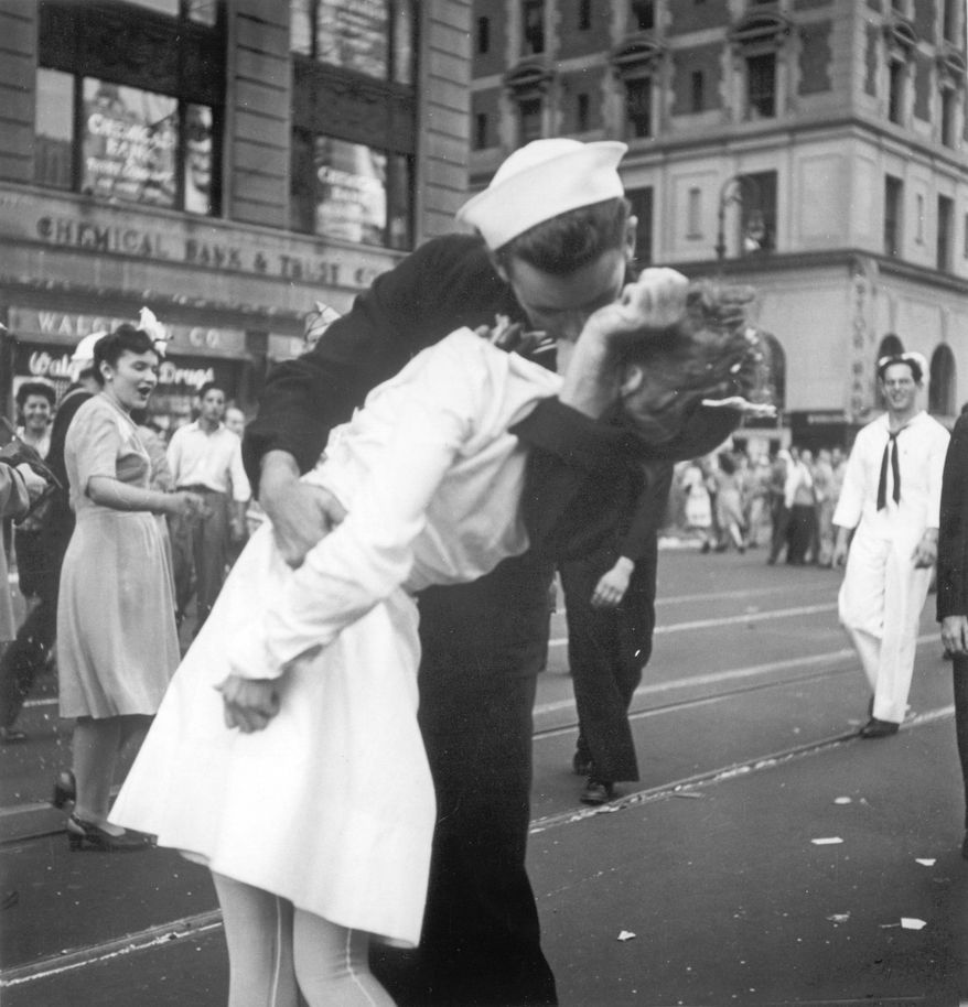 In this Tuesday, Aug. 14, 1945, picture, a sailor and a nurse kiss in Manhattan's Times Square during celebrations for the end of World War II. The celebration followed the official announcement that Japan had accepted the terms of the Potsdam Conference and surrendered. (AP Photo/U.S. Navy, Victor Jorgensen)