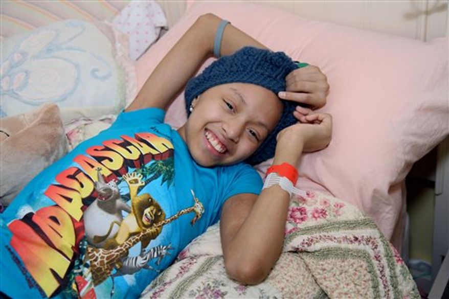 FILE - In this July 15, 2010 file photo, Shannon Tavarez relaxes in her room in the Queens Borough of New York. The 11-year-old actress who suffers from leukemia is recovering after receiving an umbilical-cord blood transplant in a New York hospital, Tuesday, Aug. 17, 2010. The treatment was performed in place of a bone marrow transplant because a suitable donor couldn't be found. Shannon had played a young Nala in "The Lion King" on Broadway. (AP Photo/Rick Maiman, File)