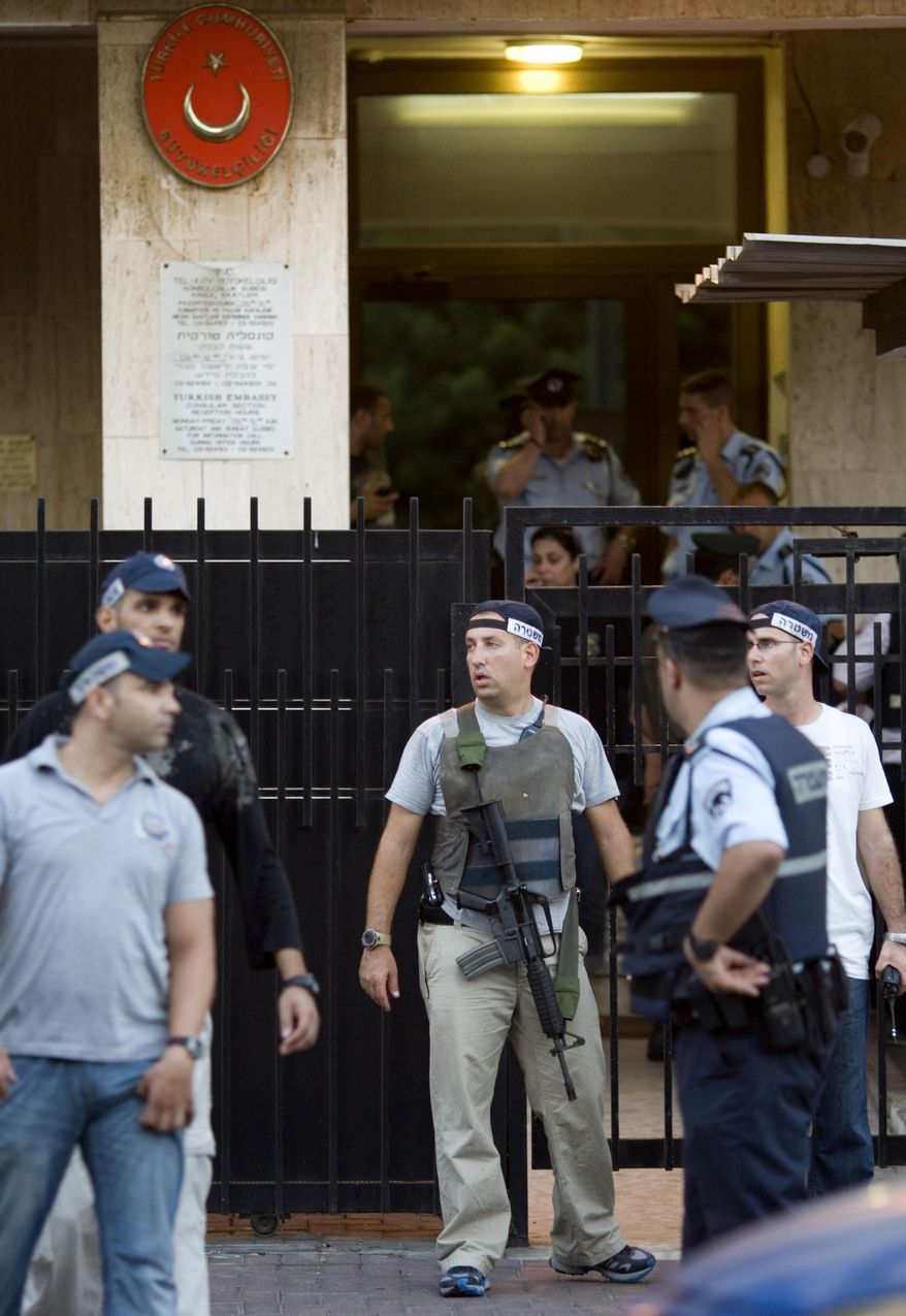 Israeli police officers are seen in front of the Turkish Embassy in Tel Aviv, Israel, Tuesday, Aug. 17, 2010. A Palestinian took hostages in the Turkish Embassy in Tel Aviv Tuesday after shots were fired outside, Israeli police and a Foreign Ministry official said, in an incident that appeared to have only an indirect link to recent tensions between the two countries. (AP Photo/Ariel Schalit)