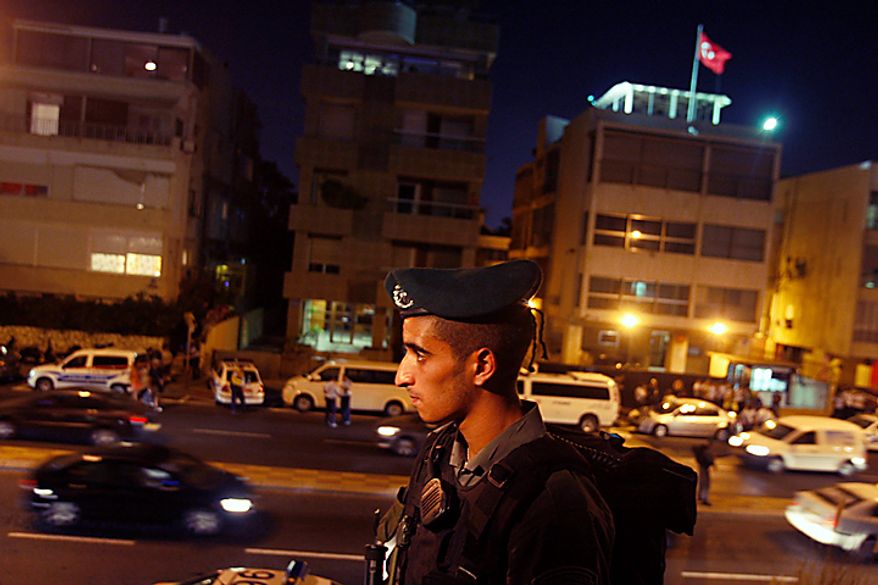 An Israeli border police officer secures the area in front of the Turkish Embassy in Tel Aviv, Israel, Tuesday, Aug. 17, 2010. Palestinian took hostages in the Turkish Embassy in Tel Aviv Tuesday after shots were fired outside, Israeli police and a Foreign Ministry official said, in an incident that appeared to have only an indirect link to recent tensions between the two countries. (AP Photo/Dan Balilty)