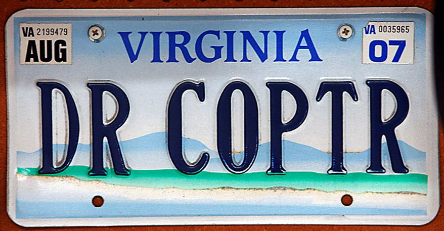A license plate belonging to Dr. David Nichols sits inside his airplane hanger in Topping, Va., Monday, Aug. 9, 2010. (AP Photo/Richmond Times-Dispatch, Bob Brown)