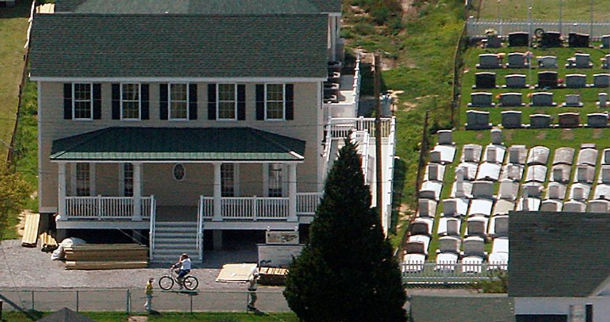 The new Tangier Island Health Clinic on Tangier Island, Va.. Monday, Aug. 9, 2010. The brand new clinic is scheduled to open Aug. 29. Dr. David Nichols, who has been flying to Tangier to care for the residents for 30 years, has been diagnosed with terminal cancer and stated that he wishes to be buried in the Swain Memorial Methodist Church Cemetary, beside the clinic. (AP Photo/Richmond Times-Dispatch, Bob Brown)