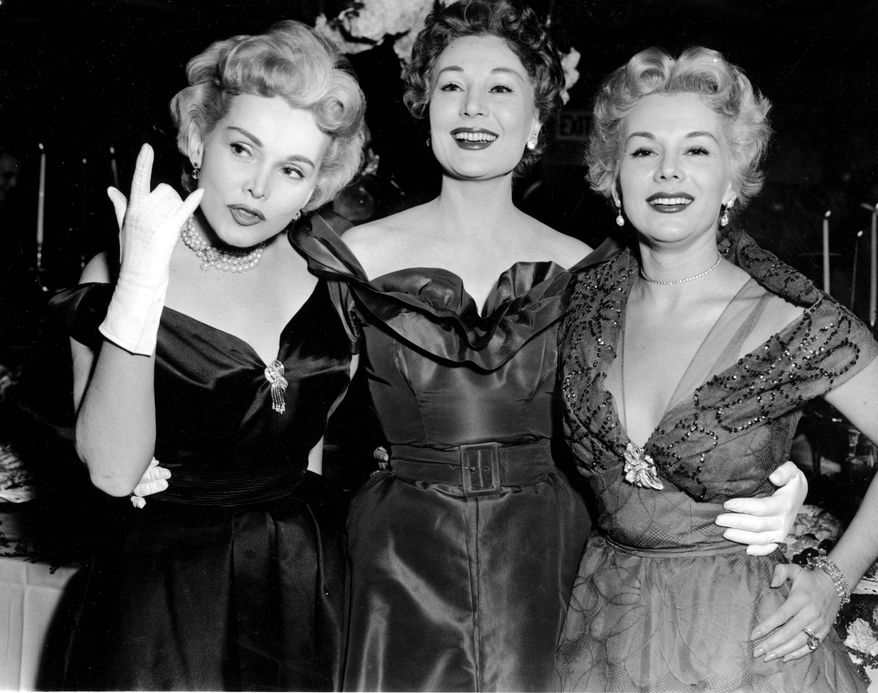 ASSOCIATED PRESS
Zsa Zsa Gabor (left) and her sisters Magda (center) and Eva, celebrate a 1955 Las Vegas nightclub engagement with a cocktail party at Ciros, then a Vegas hot spot. Zsa Zsa, 93 and the last surviving sister, is critically ill.