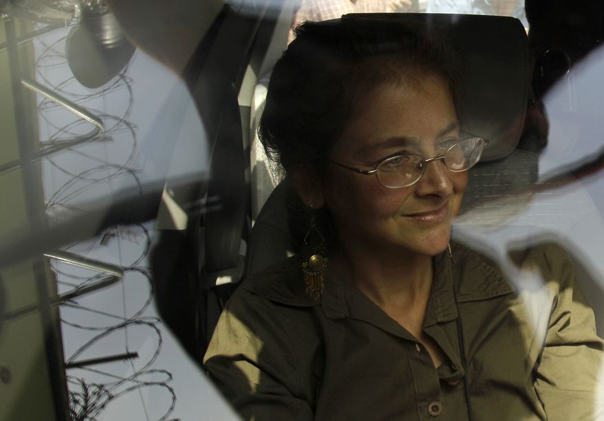 In this May 27, 2010, file photo, U.S. activist Lori Berenson sits in a car after leaving prison on parole in Lima. On Wednesday, Aug. 18, 2010, a court revoked her parole and ordered her rearrested to serve the remainder of her sentence. (AP Photo/Martin Mejia, File)