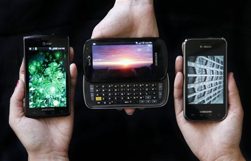 This photo taken Aug. 13, 2010, shows the Samsung Captivate, left, Samsung Epic 4G, center, and the Samsung Vibrant phones in San Francisco. (AP Photo/Jeff Chiu)