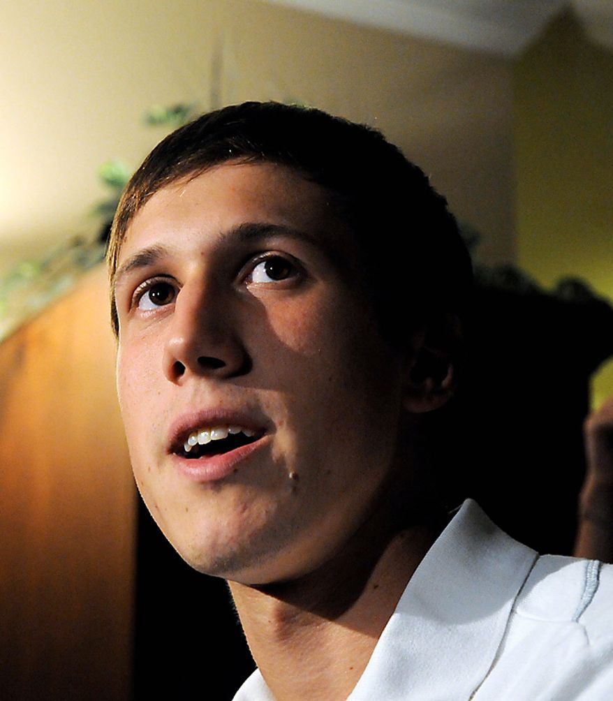 Erik Sarnello of Itasca, Ill, a juror in the corruption trial of former Gov. Rod Blagojevich, talks to reporters inside his home in Itasca on Tuesday, Aug. 17, 2010. Sarnello, 21, said the panel was deadlocked at 11-1 in favor of convicting the former Illinois governor of trying to sell or trade President Obama's former Senate seat. Sarnello also stated that a female holdout, "just did not see what we all saw" adding that the counts around the the Senate seat were "the most obvious." (AP Photo/Lois Bernstein)