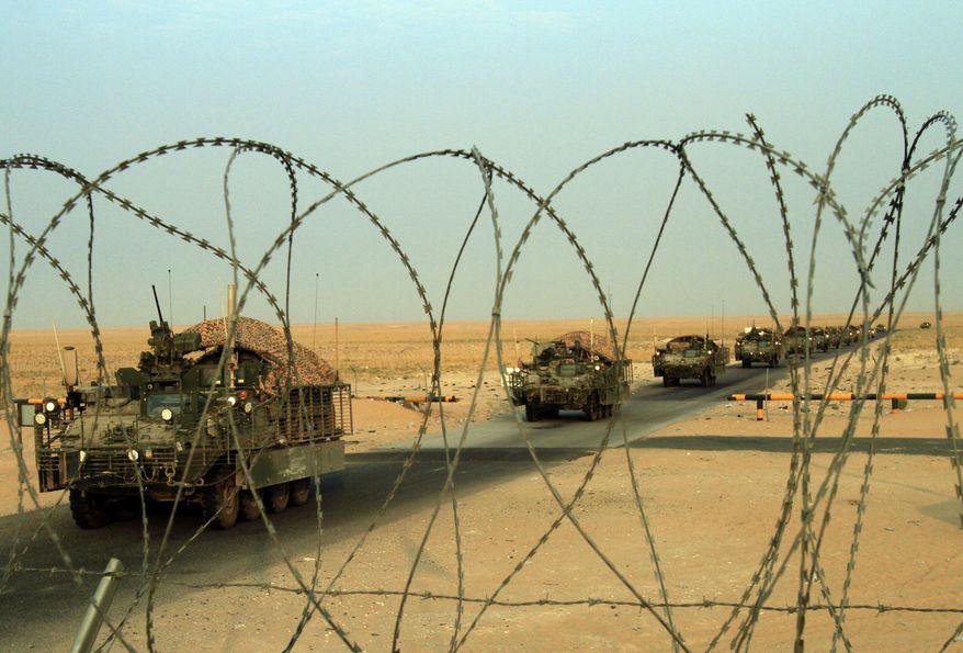 A column of U.S. Army Stryker armored vehicles cross the border from Iraq into Kuwait on Wednesday, Aug. 18, 2010. The U.S. Army&#39;s 4th Battalion, 9th Infantry Regiment, part of the 4th Brigade, 2nd Infantry Division, is the last combat brigade to leave Iraq as part of the drawdown of U.S. forces. (AP Photo/Maya Alleruzzo)