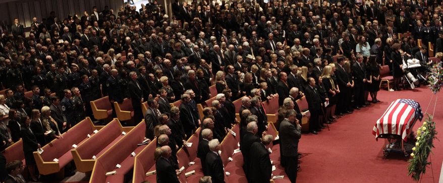 Mourners pay their respects to former Sen. Ted Stevens during funeral services at the Anchorage Baptist Temple on Wednesday, Aug. 18, 2010, in Anchorage, Alaska. (AP Photo/Rick Bowmer)