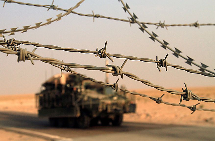 A U.S. Army Stryker armored vehicle crosses the border from Iraq into Kuwait Wednesday, Aug. 18, 2010. The U.S. Army&#39;s 4th Brigade, 2nd Infantry Division is the last combat brigade to leave Iraq as part of the drawdown of U.S. forces. (AP Photo/ Maya Alleruzzo)