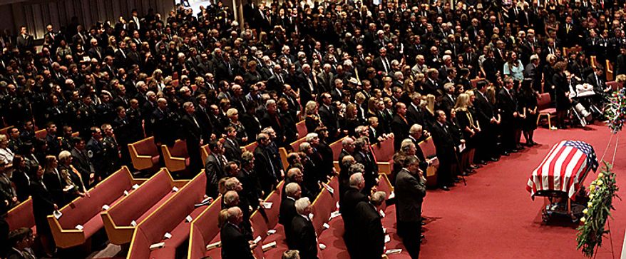 Mourners pay their respects to former U.S. Sen. Ted Stevens during funeral services at the Anchorage Baptist Temple Wednesday, Aug. 18, 2010, in Anchorage, Alaska. (AP Photo/Rick Bowmer)