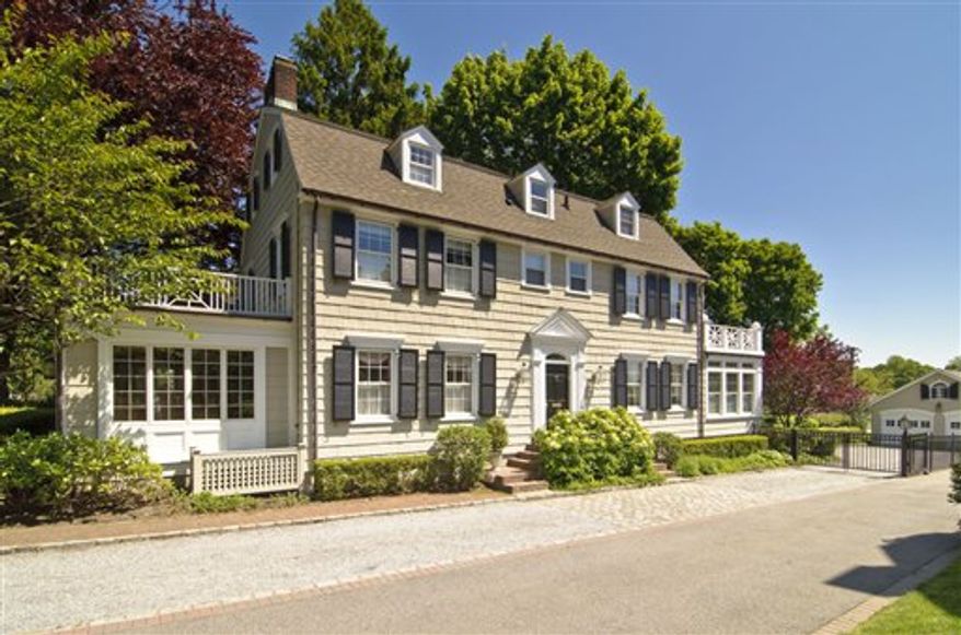 FILE - In this photo provided by Daniel Gale Sotheby's International Realty, the house made famous in the 1979 film "The Amityville Horror" is shown in this May 20, 2010 file photo taken in Amityville, N.Y.. Since the house is under contract the current owner of the New York house is holding a moving sale Saturday Aug. 21, 2010. (AP Photo/Daniel Gale Sotheby's International Realty, Kevin J Wohles) NO SALES