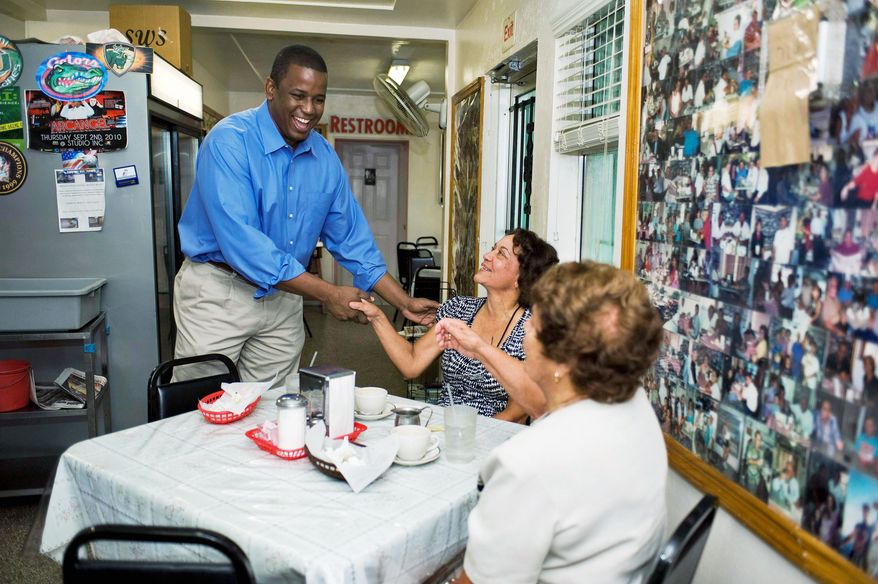 PRIMARY CONCERN: Rep. Kendrick B. Meek greets diners Monday at the West Tampa Sandwich Shop in his last-ditch effort to fend off another businessman and political newcomer, Jeff Greene, in Florida's Democratic Senate primary Tuesday. Alaska, Arizona and Vermont also hold primaries Tuesday. (Associated Press)