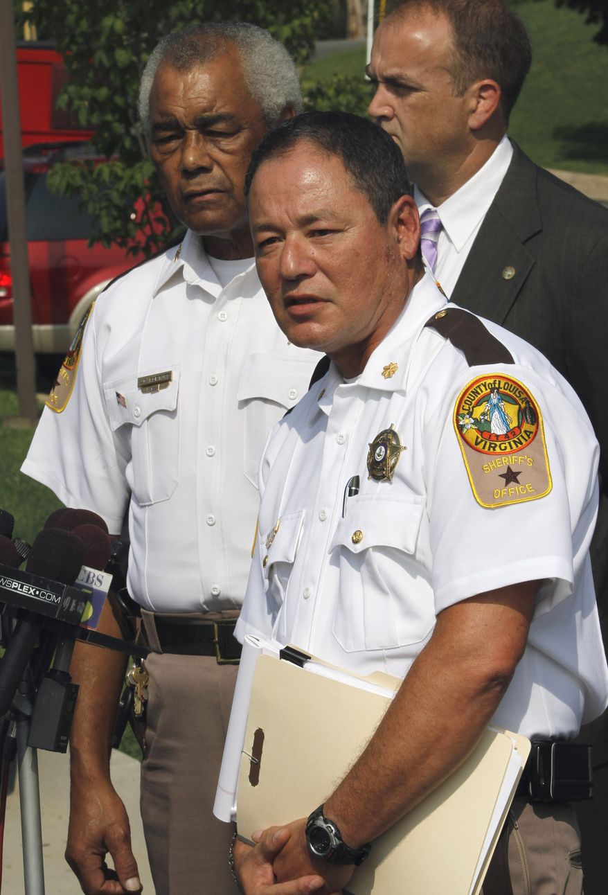 Maj. Donald Lowe (right), chief deputy of the Louisa County Sheriff's Department, speaks during a news conference along with Sheriff Ashland Fortune (left) in Louisa, Va., on Monday, Aug. 23, 2010. A gunman opened fire Sunday during a domestic dispute, killing two people and injuring four others before he was killed by police. (AP Photo/Steve Helber)