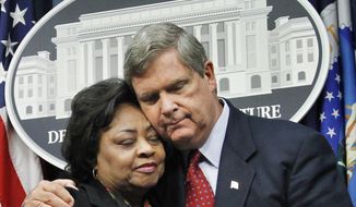Agriculture Secretary Tom Vilsack, right, puts his arm around former Agriculture Department official Shirley Sherrod, left, as they conclude a press conference at the Agriculture Department in Washington, Tuesday, Aug. 24, 2010. Mrs. Sherrod, the Agriculture Department official ousted during a racial firestorm last month, declined Tuesday to return to the agency, though she said it was tempting. (AP Photo/Manuel Balce Ceneta)
