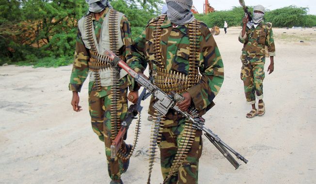 Islamist al-Shabab fighters conduct a military exercise in northern Mogadishu, Somalia. With no functioning government since 1991, militants with guns have been filling the social-justice void in Somalia with violence. (Associated Press)