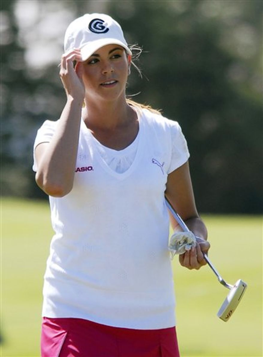 FILE- In this Feb. 15, 2008, file photo, Erica Blasberg walks up to the ninth green during the second round of the LPGA SBS Open golf tournament at Turtle Bay Resort in Kahuku, Hawaii. The Clark County , Nev., coroner's office said Tuesday, Aug. 24, 2010, that Blasberg died of suicide due to asphyxia, coupled with the presence of toxic levels of prescription medication in her system, including prescription headache, cough, pain and anti-anxiety medications. Blasberg died May 9 at her home in the suburban hills of Henderson, about 15 miles southeast of the Las Vegas Strip. The 25-year-old was found with a plastic bag over her head. (AP Photo/Ronen Zilberman, File)