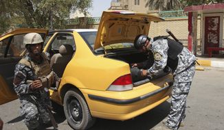 Iraqi policemen search a car at a checkpoint in Baghdad Sunday, Aug. 29, 2010. While violence in Iraq has subsided significantly since the height of the sectarian bloodshed in 2006 and 2007, militants continue to target members of Iraq&#39;s nascent security forces, undermining their ability to defend the country as the U.S. ends combat operations. (AP Photo/Karim Kadim)