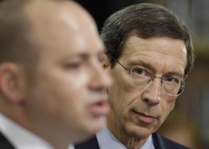 Robert Einhorn, the State Department's special adviser for nonproliferation and arms control, right, talks with Daniel Glaser, the Treasury Department's deputy assistant secretary for terrorist financing and financial crimes, left, during a press conference at the Information Resource Center of the American Embassy in Seoul, South Korea, Monday, Aug. 2, 2010. New sanctions against North Korea will target narcotics trafficking, money counterfeiting and other "illicit and deceptive" activities that provide the regime with hard currency used to build nuclear weapons, a senior U.S. envoy said Monday. (AP Photo/ Lee Jin-man)