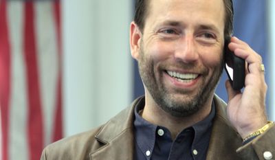 **FILE** Alaska U.S. Senate candidate Joe Miller makes phone calls from his law office in Fairbanks, Alaska, on Aug. 26, 2010. Miller, 43, stunned political pundits this week with his 1,688-vote lead over Sen. Lisa Murkowski, R-Alaska, in the Republican primary. (Associated Press)