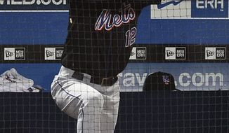 New York Mets&#39; Jeff Francoeur (12) looks on from the dugout in the ninth inning of a baseball game against the Atlanta Braves in Atlanta, Monday, Aug. 30, 2010. Atlanta won 9-3.  (AP Photo/John Bazemore)