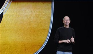 Apple CEO Steve Jobs shows the new Apple iPad display, at a news conference in San Francisco, Wednesday, Sept. 1, 2010. (AP Photo/Paul Sakuma)