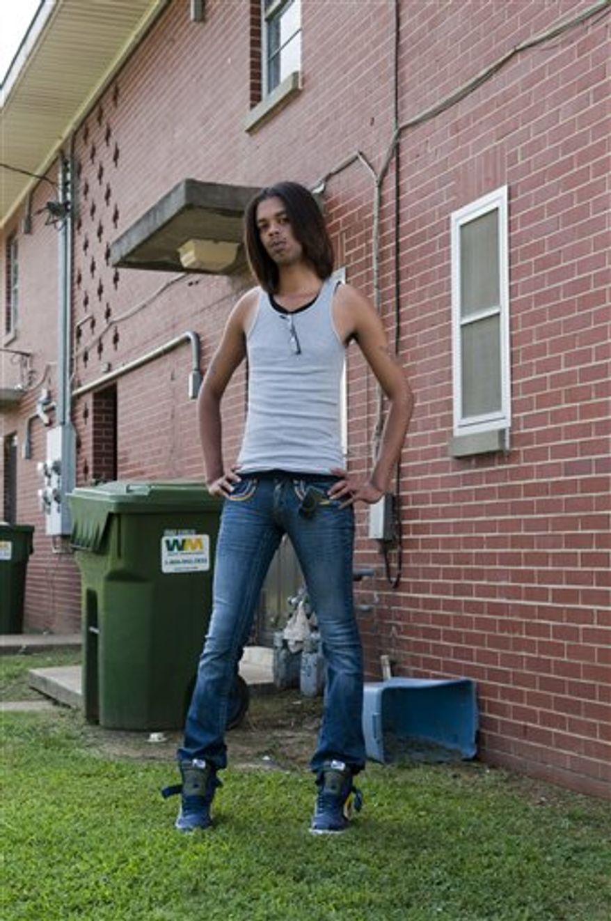 In this photo taken Aug. 27, 2010, Antoine Dodson, 24, and his sister, Kelly Dodson, 22, poses in the stairwell of the apartment complex where Kelly was attacked in Huntsville, Ala. Antoine Dodson's angry, head-shaking TV interview about an attempted rape against his younger sister in her home has turned into a chart-topping iTunes song. Some suggest, however, that the 24-year-old college student and his family are being exploited, that his online rant plays to African-American stereotypes. (AP Photo/Bob Farley)