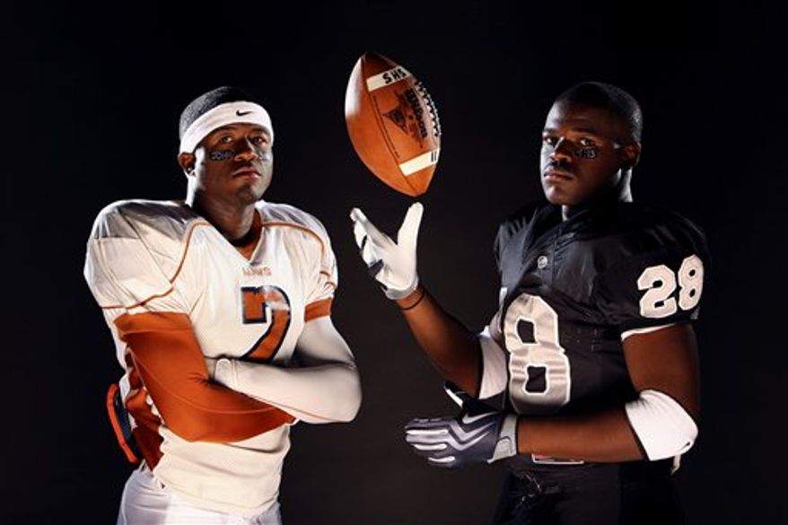 In this July 23, 2009, photo, James Madison High School running back Aaron Green, left, and Steele High School running back Malcolm Brown pose for photos in San Antonio. (AP Photo/San Antonio Express-News, Edward A. Ornelas)