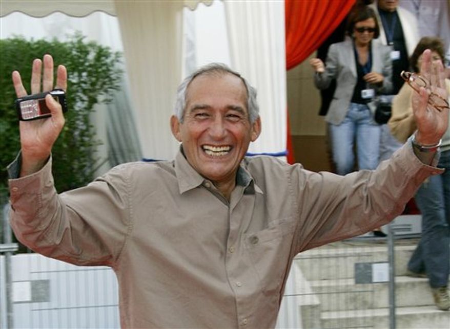 FILE - In this Sept. 5, 2005 file photo, French Director Alain Corneau waves to photographers upon his arrival at a screening, in Deauville, Normandy, France, Monday, Sept. 5, 2005. Corneau, 67, died Sunday, Aug. 29, 2010 in Paris, his agency Artemedia said. (AP Photo/Francois Mori, File)