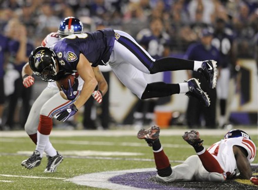 Baltimore Ravens quarterback Joe Flacco rolls out to pass against the New York Giants during the first half of an NFL preseason football game, Saturday, Aug. 28, 2010, in Baltimore. (AP Photo/Rob Carr)