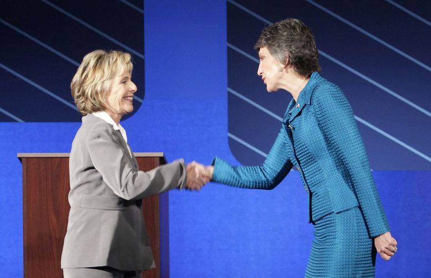 Democratic Sen. Barbara Boxer, left, shakes hands with Republican Carly Fiorina before a debate at St. Mary's College in Moraga, Calif., Wednesday, Sept. 1, 2010. (AP Photo/Jeff Chiu, Pool)