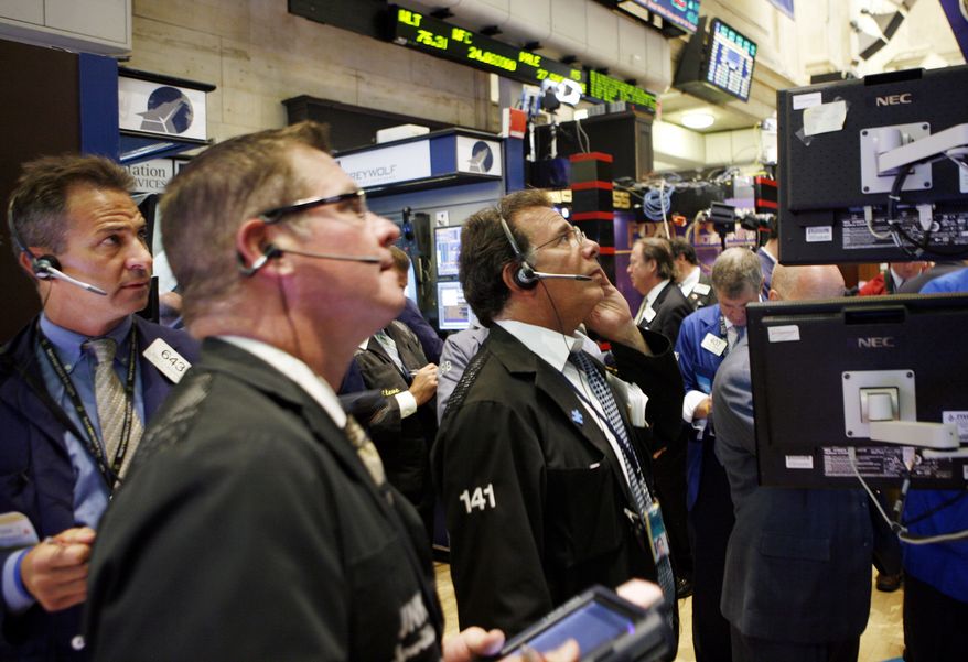 In this Sept. 1, 2010 ,photo, traders and specialists work the trading floor of the New York Stock Exchange, in New York. (AP Photo/David Karp)
