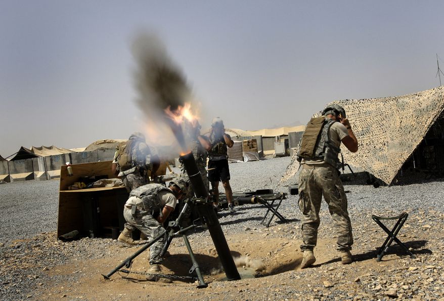 U.S. soldiers of the Fort Campbell based 1-75 Cavalry fire 122 mm mortars at a nearby Taliban position at Forward Operating Base Wilson in Kandahar Province, Southern Afghanistan, Saturday, Sept. 4, 2010. (AP Photo/ Todd Pitman)