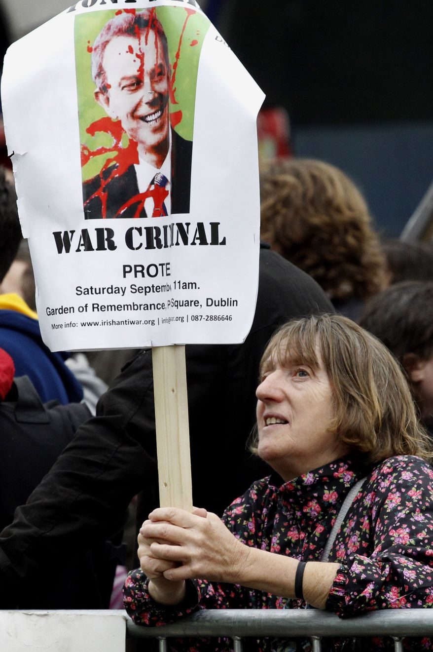 A protester demonstrates outside Eason book store in Dublin, Ireland, Saturday, Sept. 4, 2010. Former British Prime Minister Tony Blair appeared for a public book signing at the Eason book store as anti-war protesters hurled shoes and eggs at him as he arrived for his first public signing of his fast-selling memoir. (AP Photo/Peter Morrison)