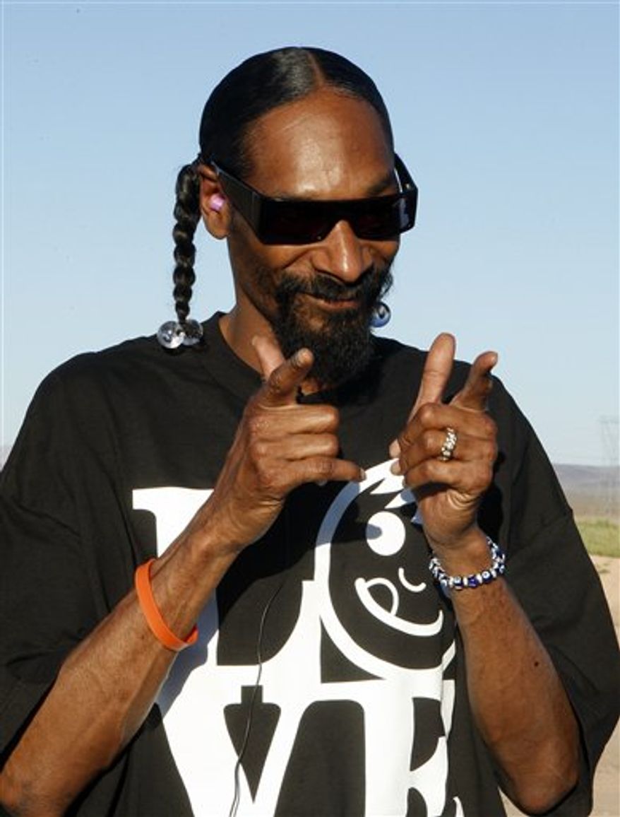 FILE - In this Aug. 19, 2010 file photo originally released by Zynga, rapper Snoop Dogg blows up an armored truck to commemorate the 10 millionth visitor to Zynga's Mafia Wars:Las Vegas in Las Vegas. (AP Photo/Zynga, Isaac Brekken)