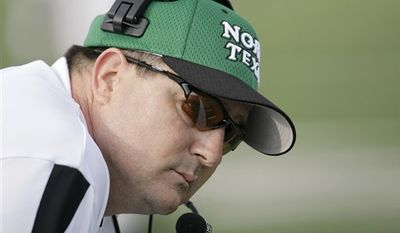 FILE - In this Nov. 10, 2007, file photo, North Texas head coach Todd Dodge looks on during an NCAA college football game against Navy in Denton, Texas.  Dodge is no longer the hot shot high school coach hired to energize the North Texas football program. After 31 losses in three years, he&#x27;s just trying to hang on to his job and avoid becoming another case study in why it&#x27;s so rare for a coach to be plucked from the preps and put in charge of a major college team.  (AP Photo/Matt Slocum, File)