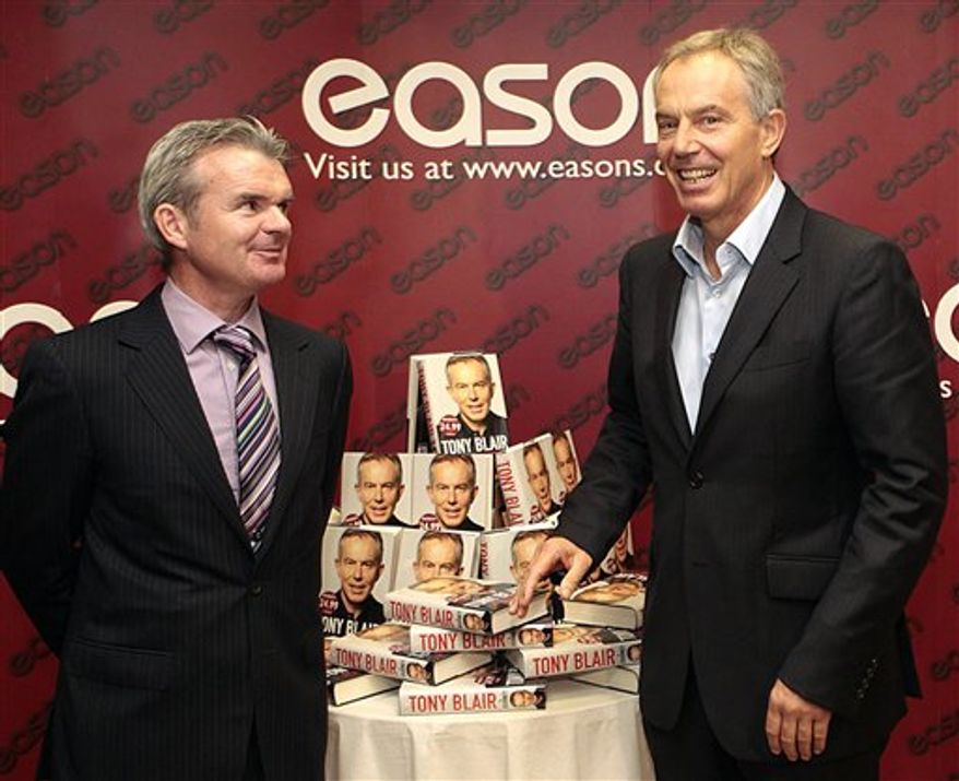 A protester demonstrates outside Eason book store in Dublin, Ireland, Saturday, Sept. 4, 2010. Former British Prime Minister Tony Blair appeared for a public book signing at the Eason book store as anti-war protesters hurled shoes and eggs at him as he arrived for his first public signing of his fast-selling memoir. (AP Photo/Peter Morrison)