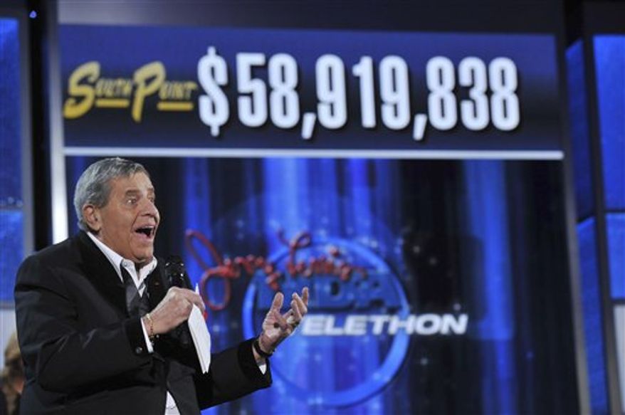 In this photo released by the Muscular Dystrophy Association, MDA National Chairman Jerry Lewis announces the total mount raised during the the Jerry Lewis MDA Telethon on Monday, Sept. 6, 2010 in Las Vegas. The Jerry Lewis MDA Telethon say contributions and pledges from this year's Labor Day event totaled $58.9 million. The amount was down from nearly $60.5 million last year and a record $65 million in 2008. But Lewis says he's heartened by Americans' ability to help others in need even when they're struggling financially. (AP Photo/Muscular Dystrophy Association, Eric Candles)