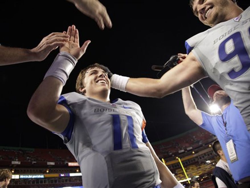 Boise State tight end Tommy Gallarda (85), right, celebrates a first quarter touchdown against Virginia Tech with fullback Dan Paul (47) during an NCAA college football game on Monday, Sept. 6, 2010 in Landover, Md. (AP Photo/Evan Vucci)
