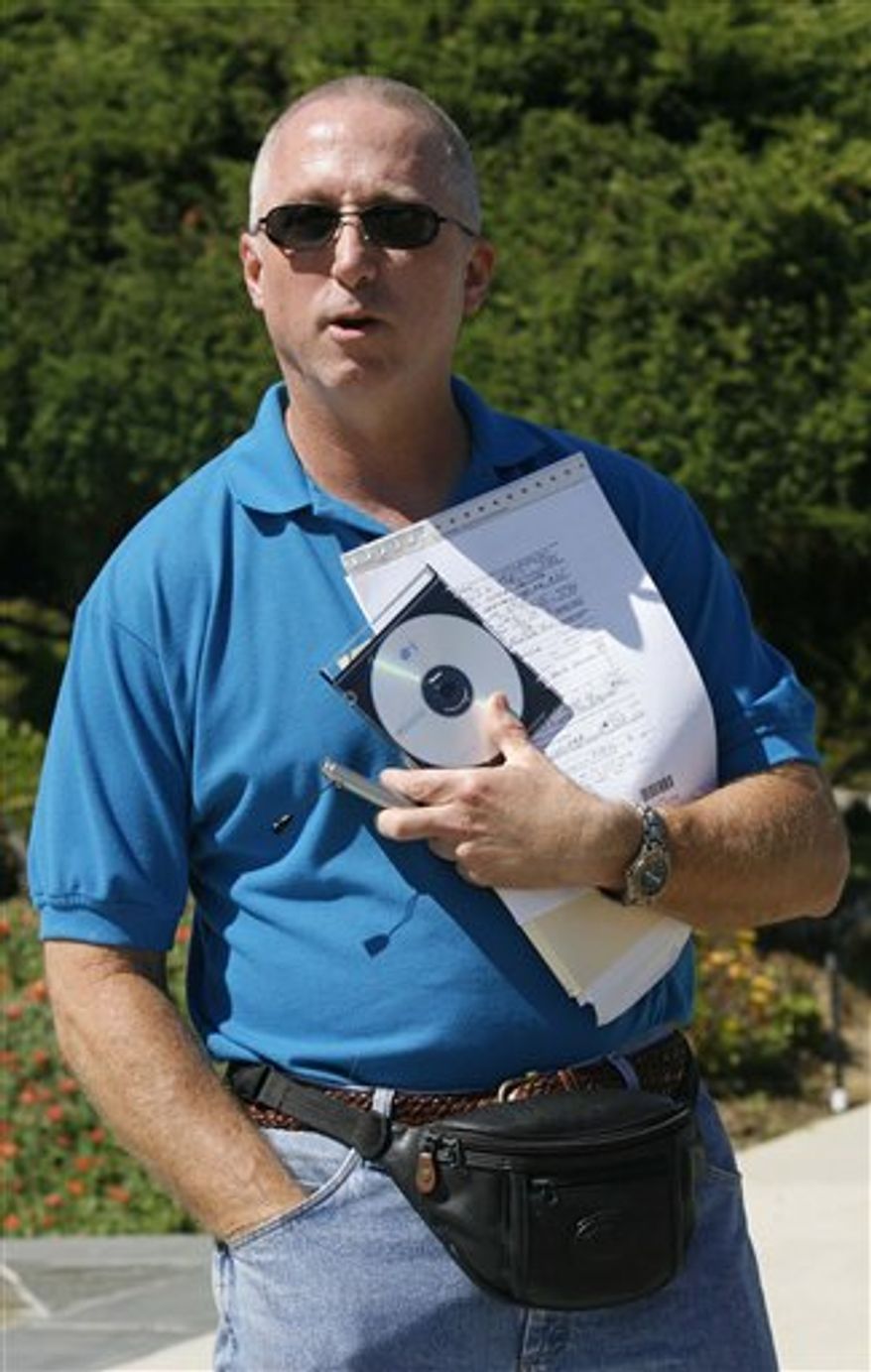 FILE - In this July 31, 2006 file photo, Los Angeles County Sheriff's deputy James Mee speaks to a reporter, as he arrived at his home in Calabasas, Calif. A judge on Tuesday, Feb. 22, 2011, said Mee can go forward with his complaint against the sheriff's department. Mee arrested actor-director Mel Gibson on suspicion of drunken driving in 2006 in Malibu. During the arrest, the Oscar-winning actor made anti-Semitic slurs to Mee, who's Jewish. Mee's lawsuit claims his superiors forced him to rewrite his initial report to remove references to the rant. However, some details were later leaked to the press. Mee was investigated as the possible source but never charged. (AP Photo/Nick Ut, File)
