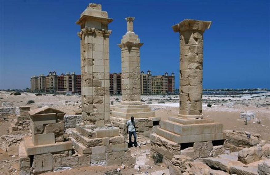 With a five star hotel in the background, a Roman bath, part of a villa located around the commercial center of the ancient city of Leukaspis , a well known Greco-Roman port overlooking the Mediterranean Sea at the costal resorts of Marina, el Alamein, Egypt Sunday, Aug. 29, 2010. Today, it's a sprawl of luxury vacation homes where Egypt's wealthy play on the white beaches of the Mediterranean coast. But 2,000 years ago, this was a thriving Greco-Roman port city, boasting villas of merchants grown rich on the wheat and olive trade. (AP Photo/Nasser Nasser)