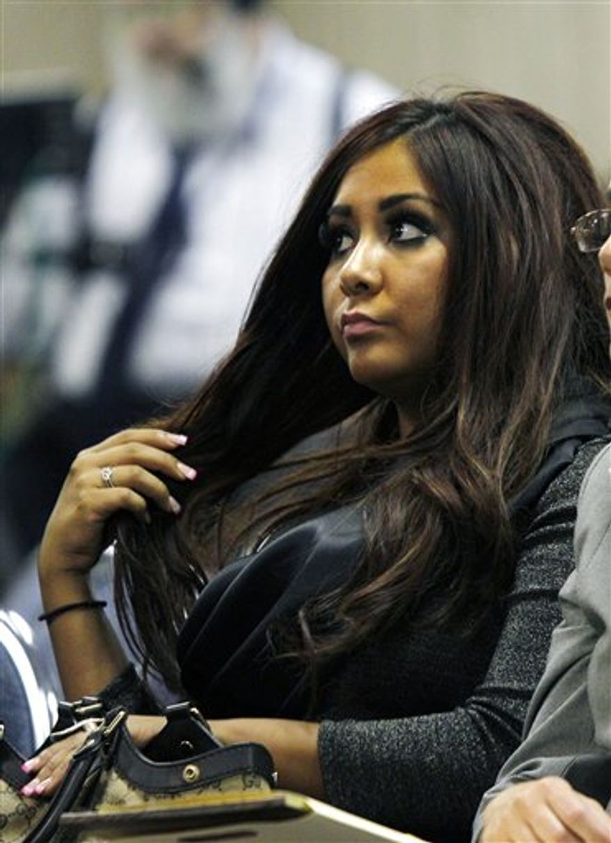 Nicole Polizzi, better known as &quot;Snooki&quot; from the MTV show &quot;Jersey Shore&quot; sits in court Wednesday, Sept. 8, 2010, in Seaside Heights, N.J., waiting to face charges of being a public nuisance and annoying others on the Seaside Heights beach in July.  (AP Photo/Mel Evans)